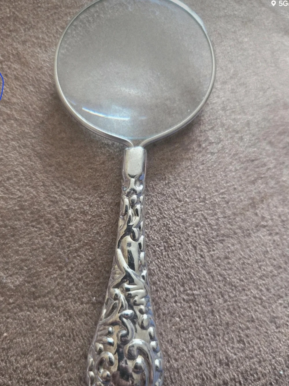 Beautiful vintage magnifying glass with detailed ornate